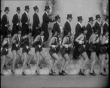 Scene from a Stage Show: a Large Dance Troop Tap Dancing on Steps in Top Hats, 1929. Creator: British Pathe Ltd.