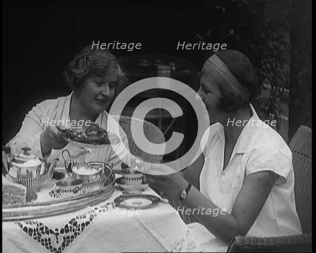 Betty May Nuthall Shoemaker, the British  World Top Female Tennis Player, Drinking Tea..., 1920. Creator: British Pathe Ltd.