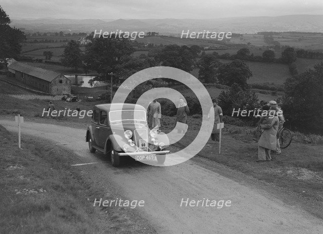Austin 10 saloon of WS Sewell competing in the South Wales Auto Club Welsh Rally, 1937 Artist: Bill Brunell.