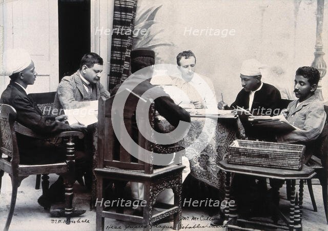 A group of men taking notes at a table, during a plague epidemic in Mandalay, 1906. Creator: Unknown.