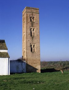 View of the brick square tower of the Cuatrovitas chapel, old Almohad mosque in Bollullos de la M…