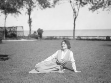 Savagoy, Henriette, seated on a lawn, 1922 July 31. Creator: Arnold Genthe.