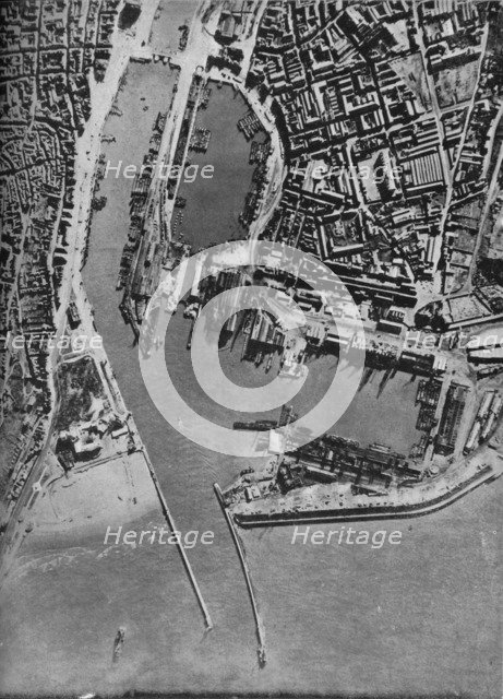 Invasion barges massed in Boulogne harbour, France, 1940 (1943).  Artist: Unknown.