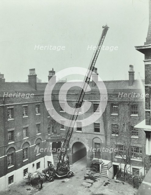 Firemen demonstrating the magirus ladder, London Fire Brigade Headquarters, London, 1910. Artist: Unknown.