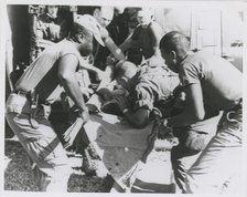 Paratrooper from the 101st Airborne Brigade applying mouth-to-mouth resuscitation..., 1967. Creator: United States Army.