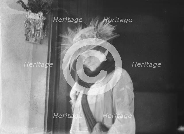 Slater, Mrs., standing by the door of a house in Long Beach, 1924 July. Creator: Arnold Genthe.