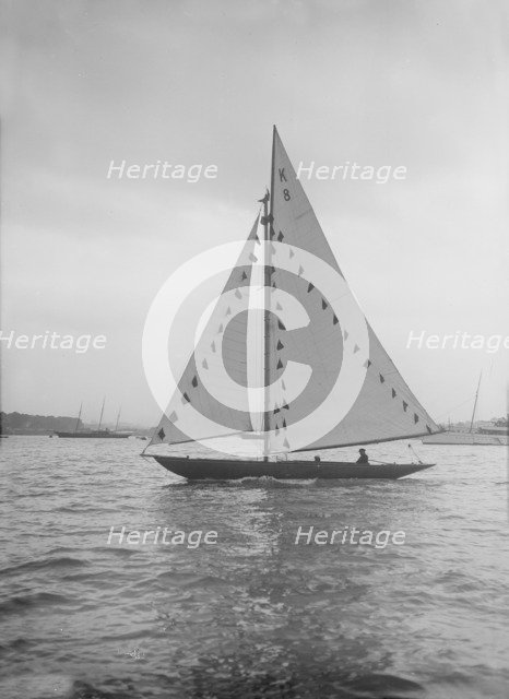 The 7 Metre sailing yacht 'Pinaster' (K8) with prize flags, 1912. Creator: Kirk & Sons of Cowes.