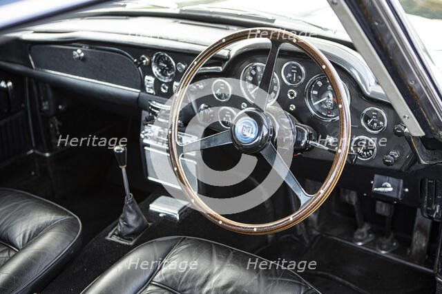 Steering wheel and dashboard of a 1965 Aston Martin DB5. Creator: Unknown.