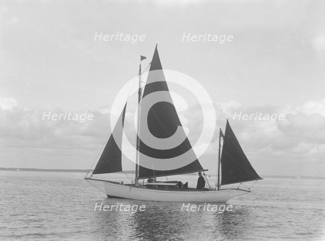 The 4 ton yawl 'Mandy' under sail, 1922. Creator: Kirk & Sons of Cowes.