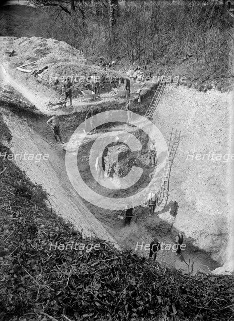 Excavation at Avebury, Wiltshire, 1922. Artist: Harold St George Gray