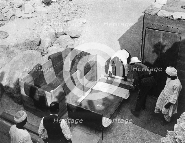Archaeologists working  at the Tomb of Tutankhamun, Valley of the Kings, Egypt, 1922. Artist: Harry Burton