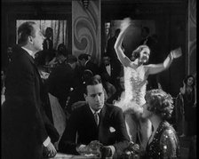 Scene from a 1920s Film. Two Actors Portraying a Couple in a Night Club Scene Whilst a Band...,1920s Creator: British Pathe Ltd.