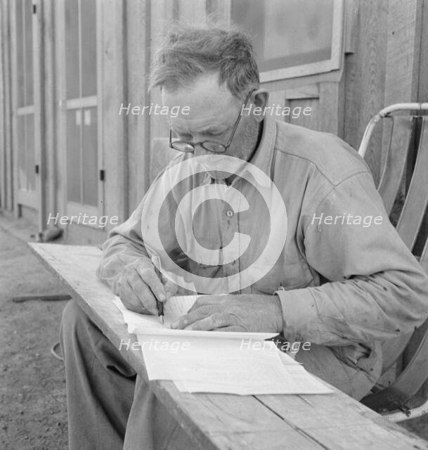 Oklahoma farmer, now living in Cow Hollow, is a FSA borrower, Malheur County, Oregon, 1939. Creator: Dorothea Lange.