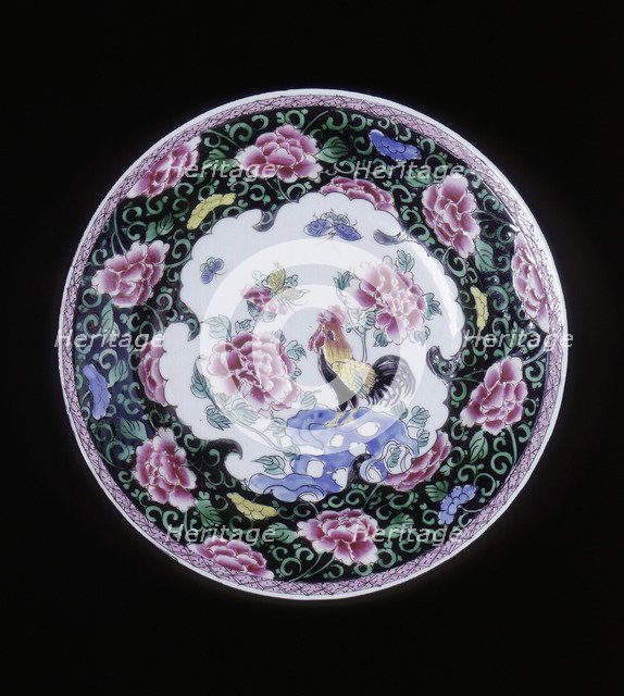 European copy of a Chinese famille noire plate with cockerel looking at a butterfly, 20th century. Artist: Unknown