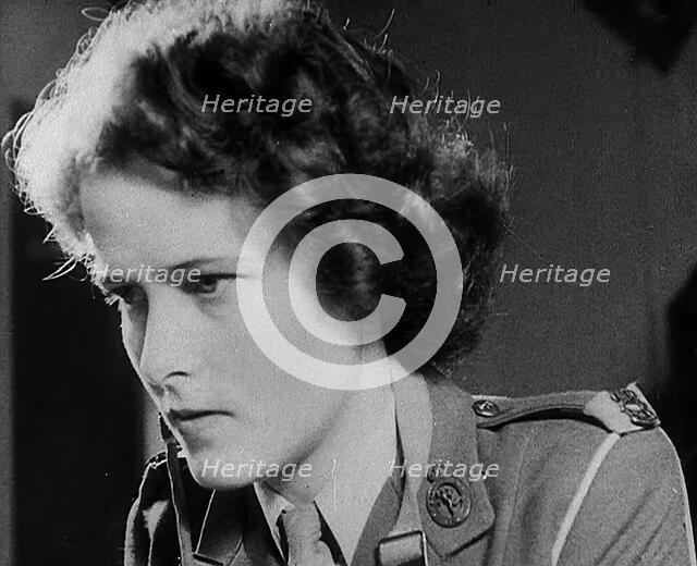 A Woman Operating a Radio, 1940. Creator: British Pathe Ltd.