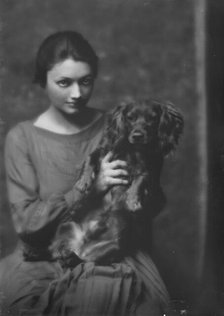 Miss Katharine Cornell, with dog, portrait photograph, 1917 Nov. 20. Creator: Arnold Genthe.