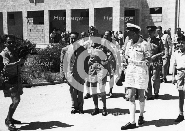Count Folke Bernadotte (1895-1948) with UN men in the hall of the National Institutions. Artist: Unknown