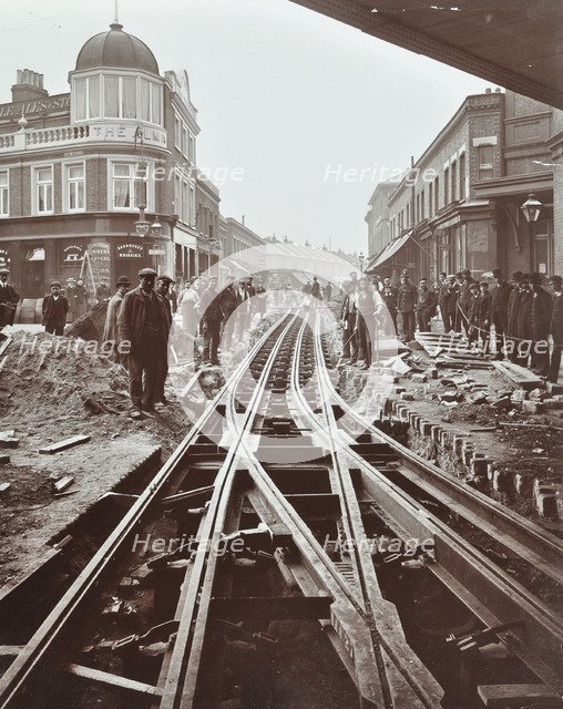 Men working on tramline electricification, Wandsworth, London, 1906. Artist: Unknown.