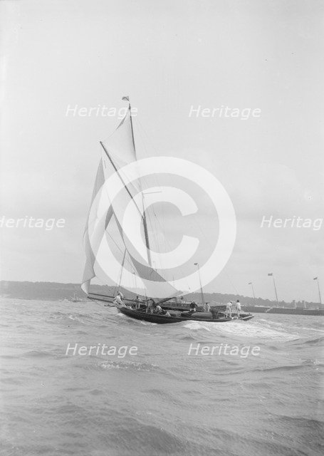 The gaff rigged cutter 'Bloodhound' sailing on a broad reach, August 1912. Creator: Kirk & Sons of Cowes.