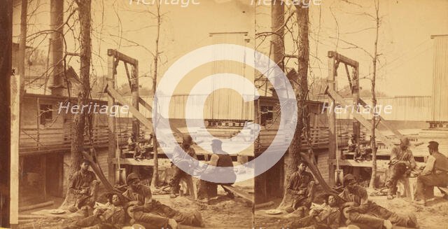 North Carolina. Negro boatmen at lunch, c1850-c1930. Creator: Rufus Morgan.
