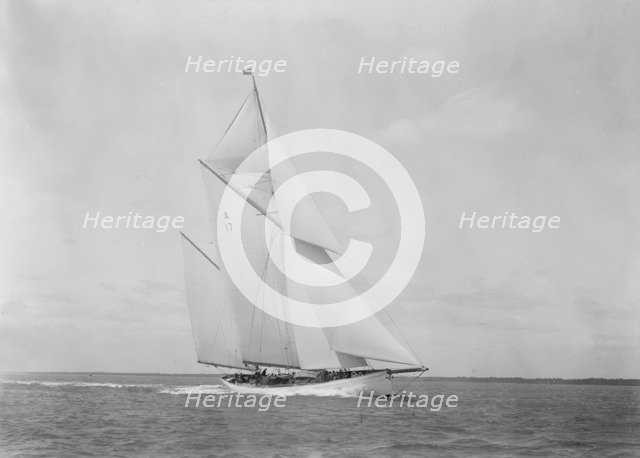 The 118 foot racing yacht 'Cariad' making good headway, 1933. Creator: Kirk & Sons of Cowes.