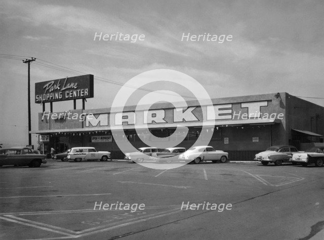 Cars parked outside a supermarket, USA, c1956. Artist: Unknown