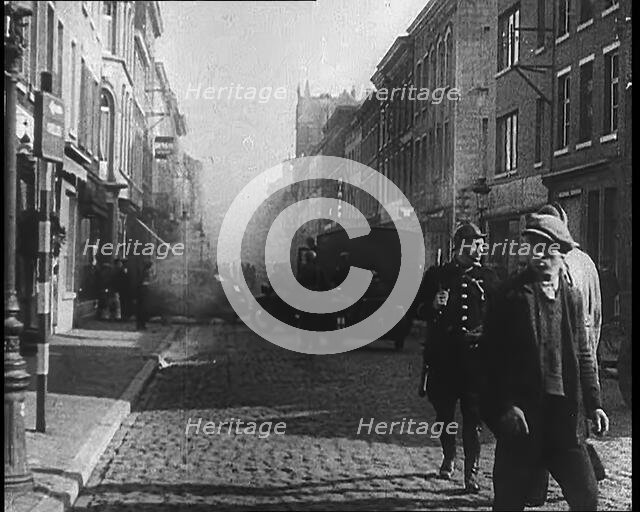 French Refugees Walking Through a Ruined Town, 1940. Creator: British Pathe Ltd.