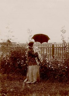 A walk in the garden at the Yudins' dacha in Tarakanovo, 1903. Creator: Unknown.