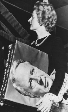 Margaret Thatcher with a picture of Ted Heath under her arm, Dudley, 31st January 1975. Artist: Unknown