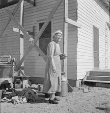 Soper grandmother helps the large family, Willow Creek area, Malheur County, Oregon, 1939. Creator: Dorothea Lange.