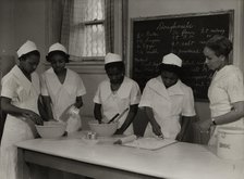 Girls instructed in pastry making at Colored Household Training School, 1937. Creator: Wilson.