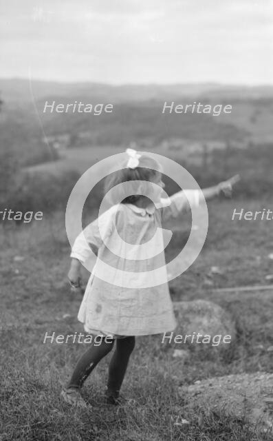 MacKaye, Percy, daughter of, standing outdoors, 1913 Sept. Creator: Arnold Genthe.