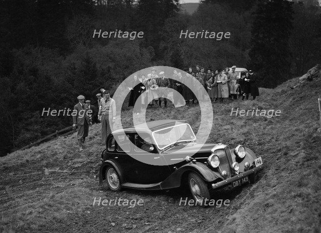 Riley of F Broomfield competing in the MCC Edinburgh Trial, Roxburghshire, Scotland, 1938. Artist: Bill Brunell.