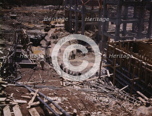 Excavating within the log cofferdam during an early stage of construction, Douglas Dam, Tenn., 1942. Creator: Alfred T Palmer.