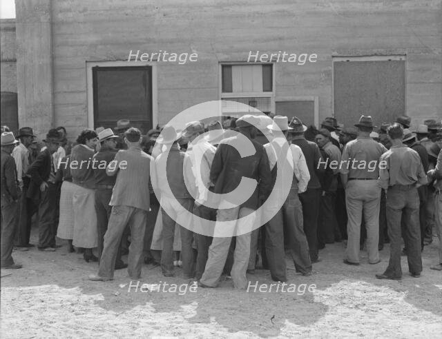 Waiting for relief checks, Calipatria, California, 1937. Creator: Dorothea Lange.