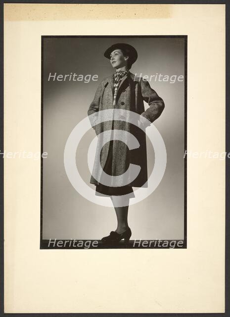 Woman modeling coat, early 1940s. Creator: Gunther Krampf.