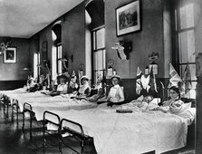 Hahnemann Hospital and Homeopathic Dispensaries, Liverpool: a women's ward, decorated..., [1910?]. Creator: Unknown.