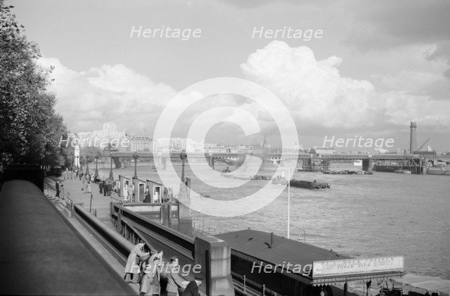 A view of Hungerford Bridge and River Thames, Lambeth, London, c1945-1965. Artist: SW Rawlings