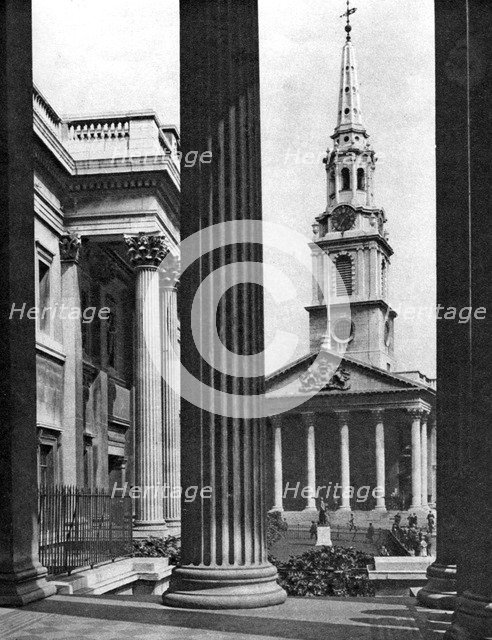 St Martin-in-the-Fields seen between the columns of the National Gallery, London, 1926-1927.Artist: McLeish