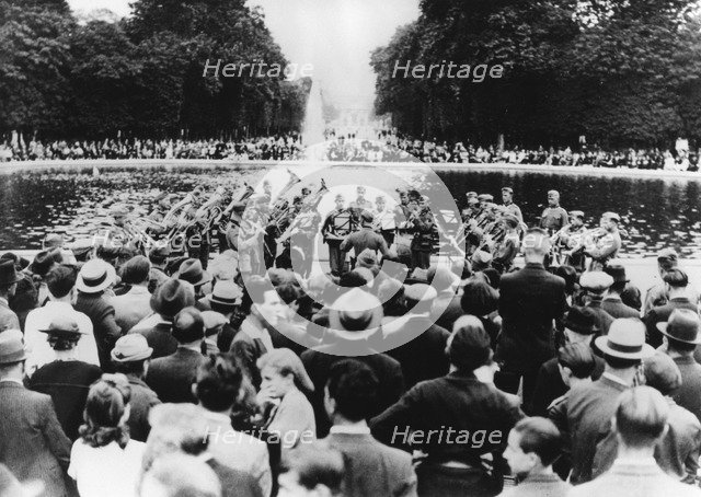 German military concert in the Garden of the Tuileries, Paris, 15 August 1940. Artist: Unknown