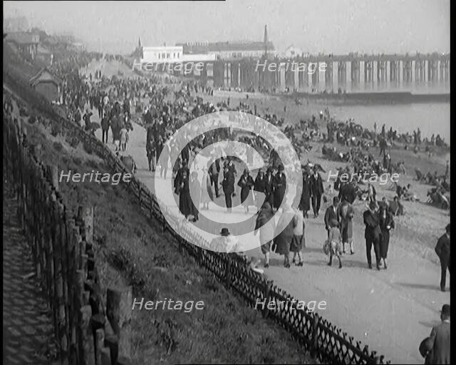 A Crowd of Civilians Sitting on Deckchairs at the Beach, 1926. Creator: British Pathe Ltd.