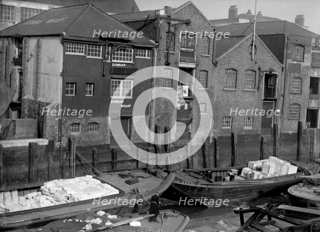Riverside view of Dunbar Wharf, Narrow Street, London, c1945-c1965. Artist: SW Rawlings