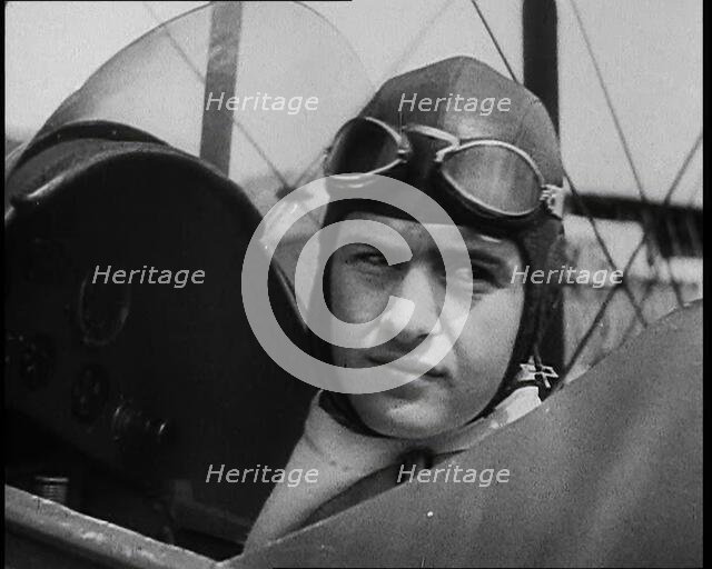 Bruno Mussolini, Son of Italian Leader Benito Mussolini, in Flying Cap Sitting in the..., 1937. Creator: British Pathe Ltd.