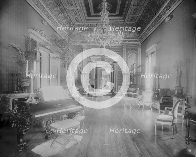 Interior view of a large hall with piano, chairs, small tables, and..., Washington, DC, c1890 - 1910 Creator: Frances Benjamin Johnston.