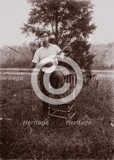 Untitled (man with banjo, neg, #1), c1931, printed c1975. Creator: Wendell Hotter.