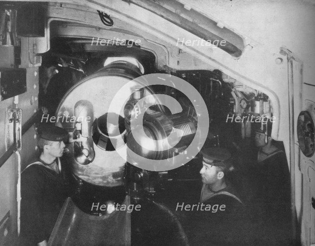 'Inside the Barbette of a Battleship showing the opened breech of a 13'5 inch gun', 1914. Artist: Unknown.