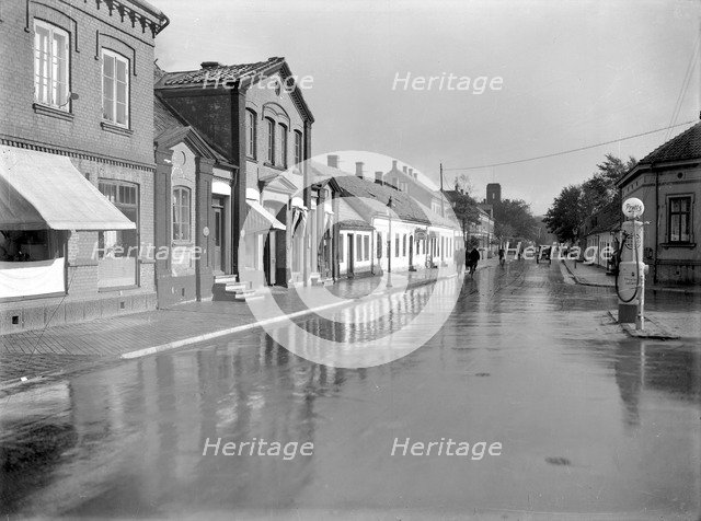 Petrol pump in a built-up area, Landskrona, Sweden, 1930. Artist: Unknown