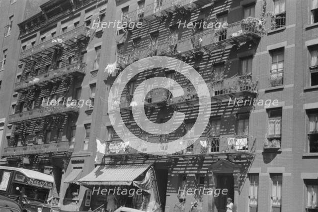 House fronts, 61st Street between 1st and 3rd Avenues, New York, 1938. Creator: Walker Evans.