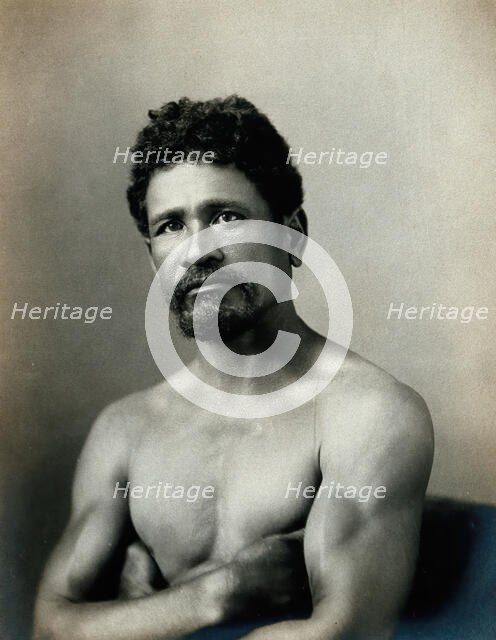 A barechested, bearded Samoan man, with his arms crossed, c1900. Creator: Unknown.