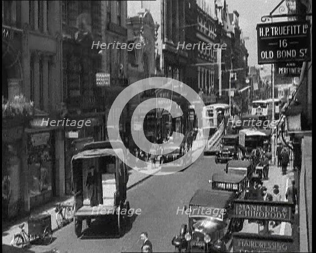 Traffic and Crowds Moving Through Old Bond Street, 1930s. Creator: British Pathe Ltd.